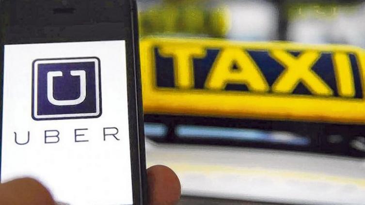 Uber quiere llegar a Rosario y los taxistas en pie de guerra